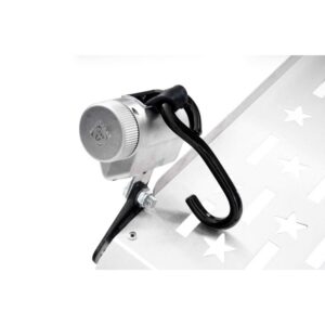 Close-up of a metallic bike lock attached to a perforated metal surface with star-shaped cutouts, featuring a black hook and a silver combination dial—reminiscent of the robust security mechanisms used in the Harmar Fusion Lift (AL300-MW) platform lift systems.