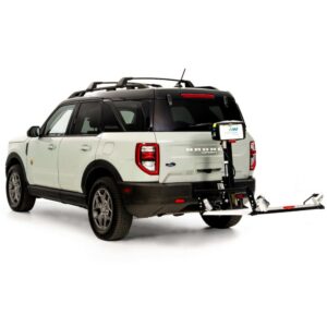 A white Ford Bronco SUV with a black roof is equipped with a Harmar Fusion Lift (AL300-MW) attached to its rear hitch, complemented by a convenient side entry platform lift for enhanced accessibility.