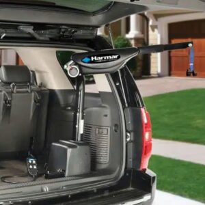 The Harmar AL425 Hoist Lift with Power Lift and Rotate is expertly installed in the back of an SUV, providing seamless assistance with transporting mobility equipment.