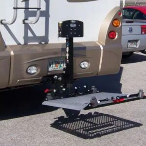 RV featuring a Harmar RV Lift (AL300RV) for an extra large scooter mounted at the rear, with a car partially visible in the background over a parking area.