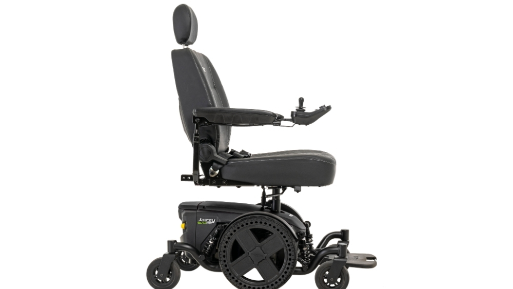 A black Jazzy EVO 614HD Power Wheelchair with a high backrest, adjustable armrests, and joystick controller, displayed from the side against a white background.