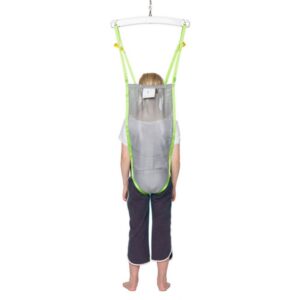 A child stands in a Human Care Activity Sling, suspended from a metal frame and viewed from the back.