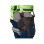 Close-up of a person wearing a green and black safety harness with padded leg straps and adjustable buckles, shown from waist to mid-thigh—similar in design to the supportive Human Care Hip Belt Sling (Copy).