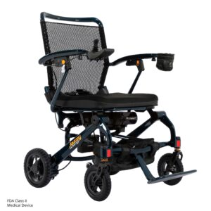 The Jazzy Carbon 27 Power Wheelchair is a lightweight, foldable electric wheelchair featuring a mesh backrest, padded seat, footrest, small wheels, cup holder, and is classified as an FDA Class II medical device.
