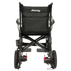 Rear view of a black Jazzy Carbon 27X Power Wheelchair with large rear wheels, footrests, and a storage pouch attached to the backrest.