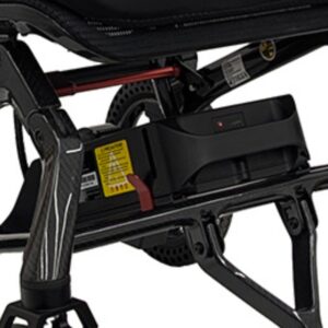 Close-up of the 10AH Lithium Battery for Jazzy Ultra Light installed beneath the seat, highlighting safety labels, indicator lights, and part of the frame.