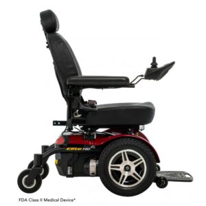 Side view of a Jazzy Elite HD Power Wheelchair featuring a black seat and armrests, red base, large rear wheels, and joystick control mounted on the right armrest. Label below indicates FDA Class II Medical Device.
