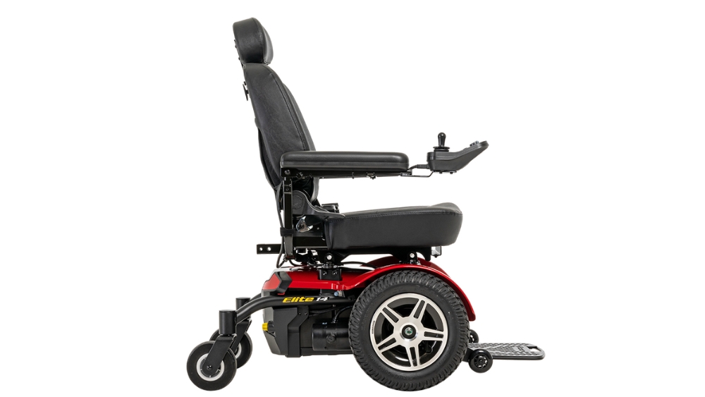 Side view of a Jazzy Elite 14 Power Wheelchair featuring a black seat, armrests, footrest, control panel, and red base.