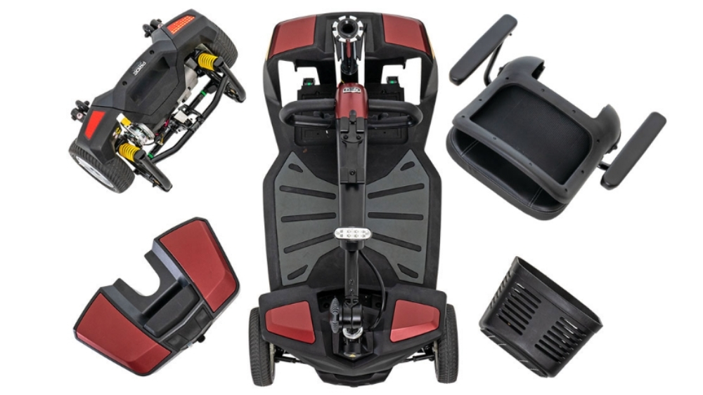 Disassembled Go Go® Endurance Li 4-Wheel Scooter with red and black components, including the base, seat, basket, front and rear sections, all arranged on a white background.