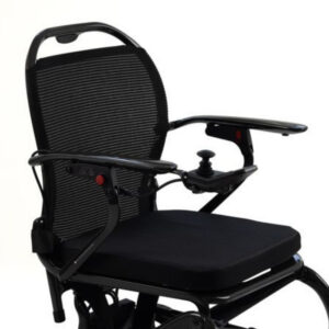 Black Monarch Mobility MM60 Carbon motorized wheelchair with a mesh backrest, padded seat, and a joystick controller on the armrest.