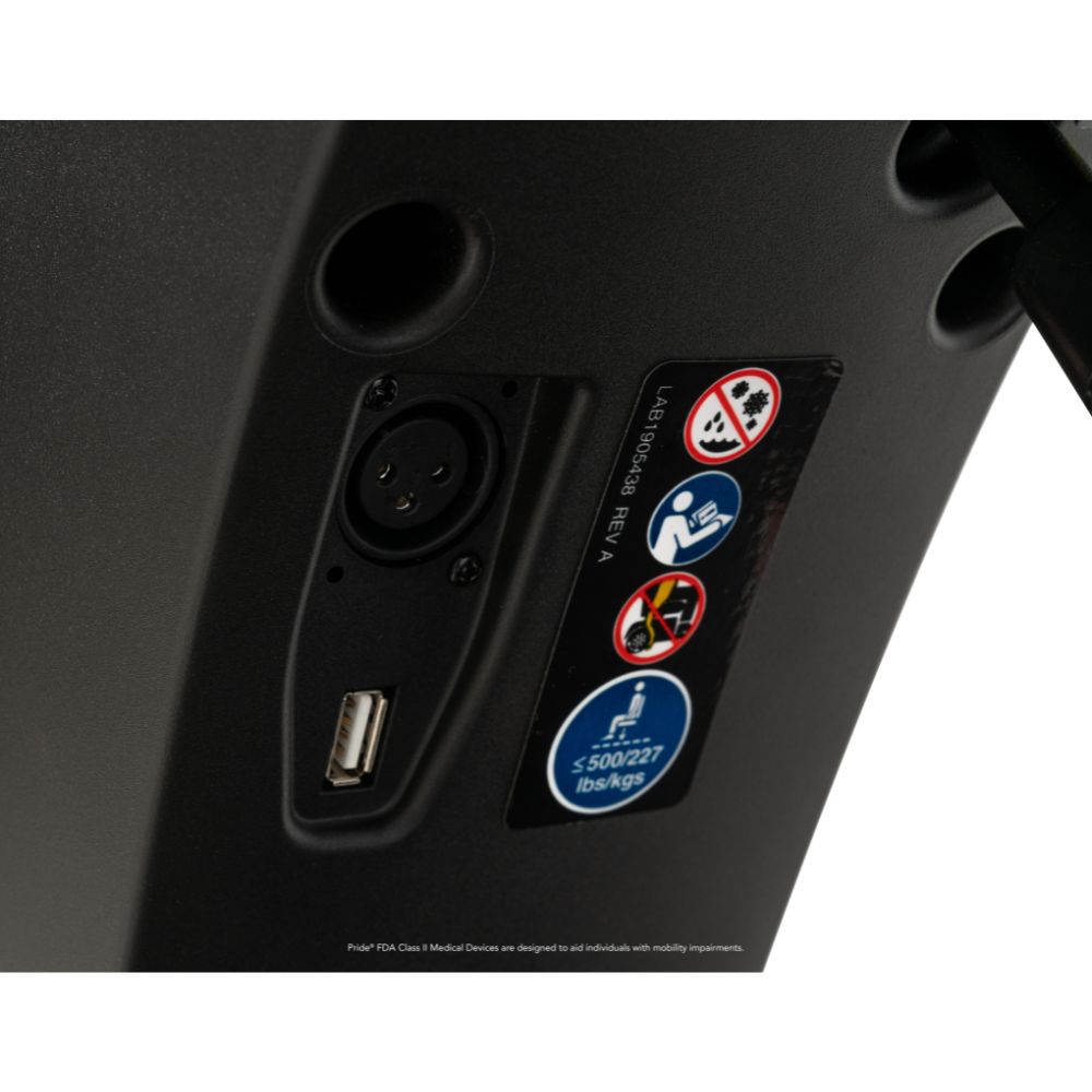 Close-up of a Maxima 4-Wheel Scooter control panel featuring an XLR port, a USB port, and stickers displaying safety warnings and a 500 lb (227 kg) weight limit.