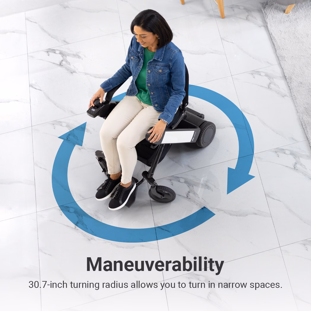 A woman in a WHILL Model F power wheelchair demonstrates its 30.7-inch turning radius on a tiled floor, with blue arrows indicating maneuverability.