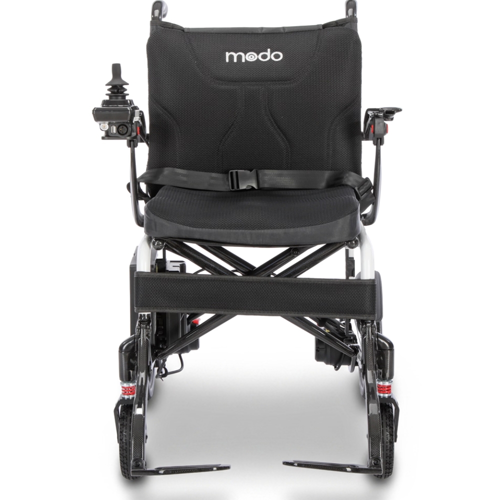 Front view of the Modo Breeze, a black electric wheelchair featuring modo branding, armrests, a seatbelt, and a joystick control on the left armrest.