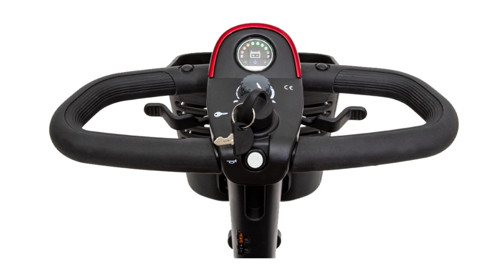 Close-up view of the control panel of a Go Go™ Sport 3-Wheel Scooter, showing handlebars, a key in the ignition, and a battery indicator gauge.