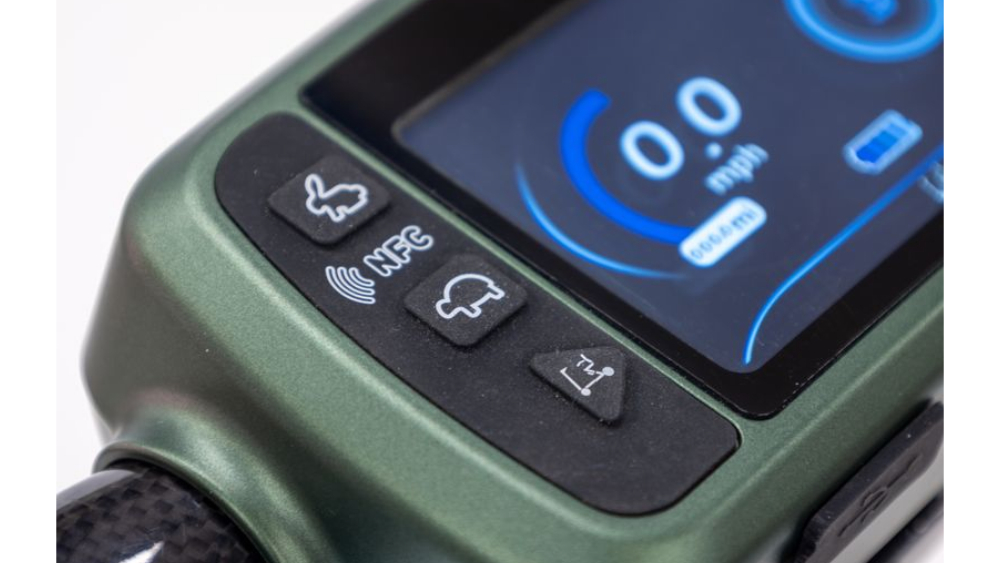 Control panel of a Monarch Mobility Smarti Plus mobility scooter featuring a digital speed display and rubber buttons for speed, NFC, vehicle settings, and folding.