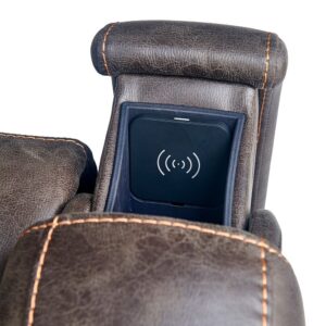 Close-up of the Titan Lift Chair’s brown leather armrest with orange stitching, featuring a built-in wireless charging pad inside its compartment.
