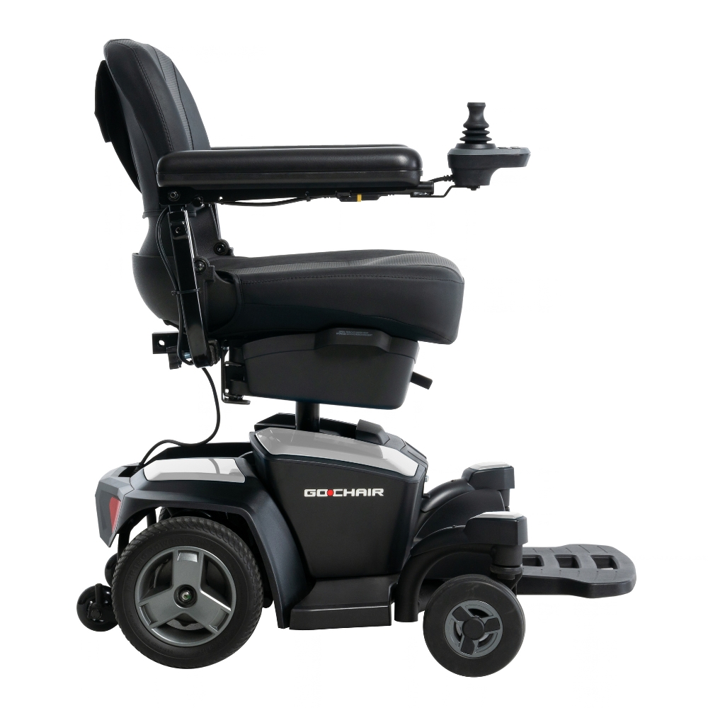 Go Chair Power Wheelchair featuring armrests, a joystick control mounted on the right arm, a footrest, and large rear wheels, with the Go Chair logo displayed on the side.