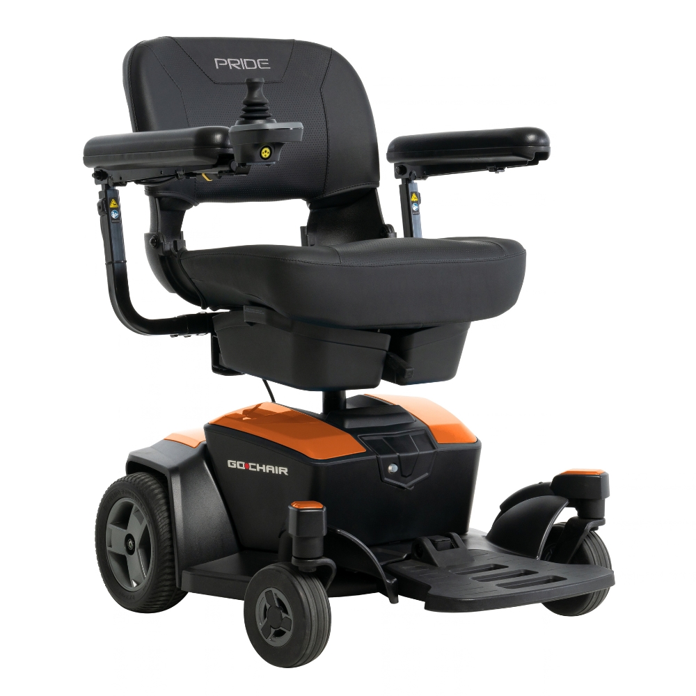A Go Chair Power Wheelchair in black and orange, featuring armrests, joystick control, and four wheels, displayed on a white background.