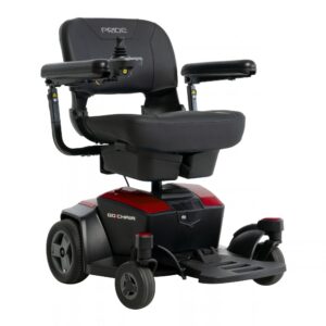 A black Go Chair Power Wheelchair featuring armrests, a joystick control on the right armrest, four wheels, and a footrest. The Pride branding is visible on the seat back.