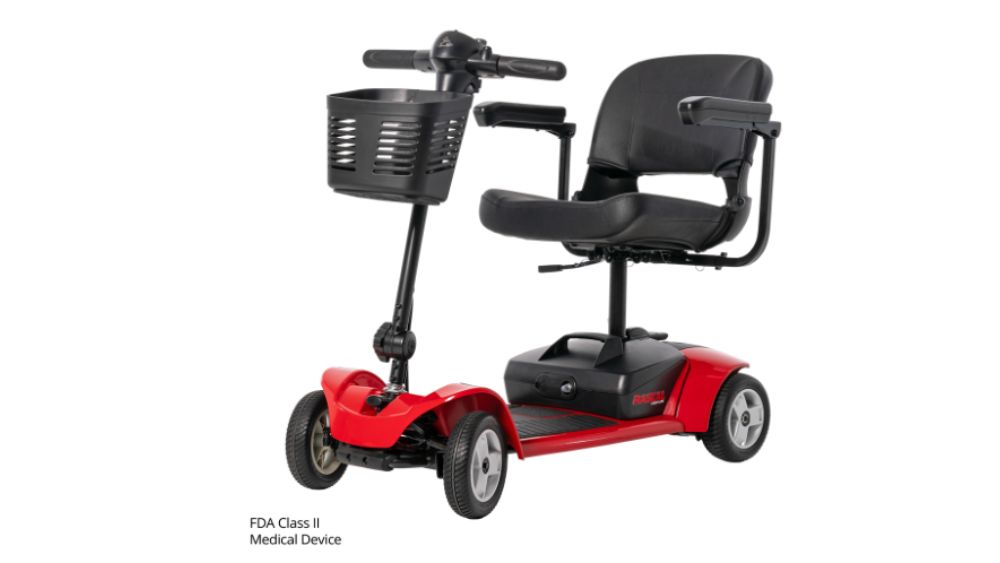 The Venture 4-Wheel Scooter features a bold red design, three wheels, a comfortable black seat with armrests, and a convenient front basket. This FDA Class II medical device combines style and versatility, with this designation noted in small text at the bottom left.