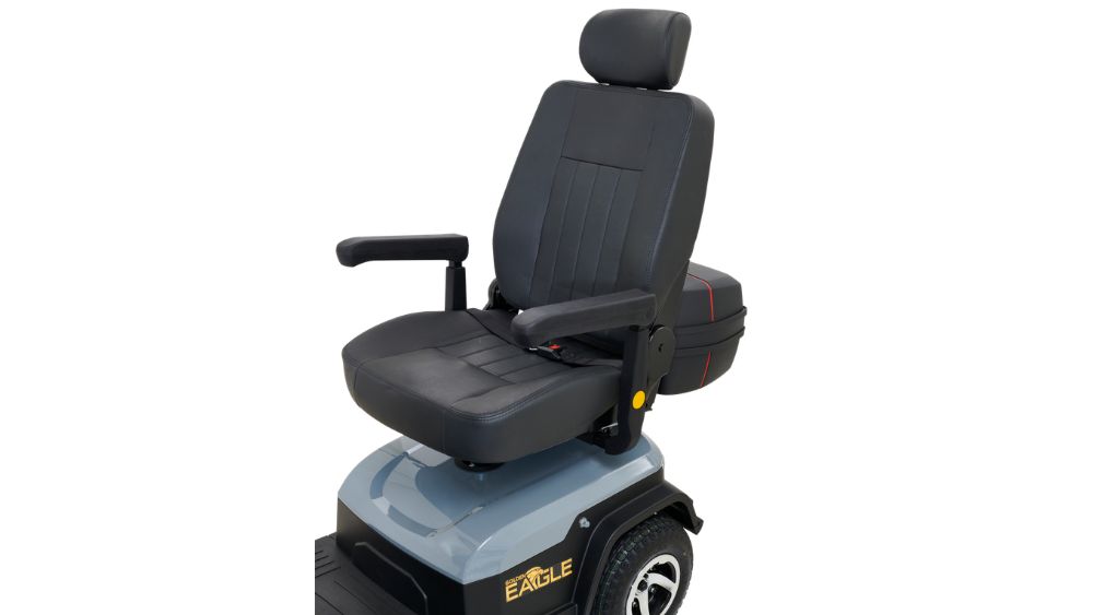 Black cushioned seat with armrests and headrest mounted on a mobility scooter base, labeled Eagle 4-Wheel Scooter, against a white background.