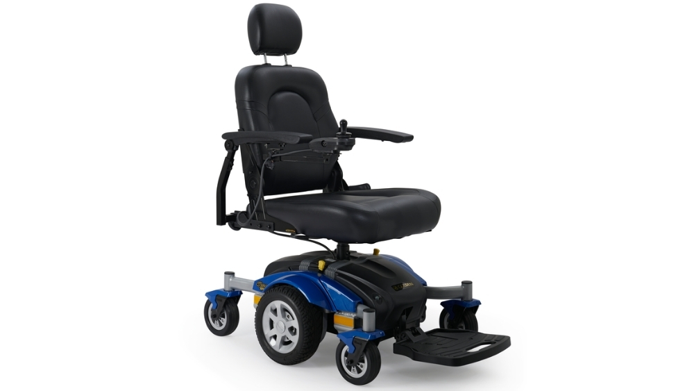 A Compass Sport Power Wheelchair in blue and black, featuring a padded seat, armrests, footrest, and headrest, displayed against a white background.
