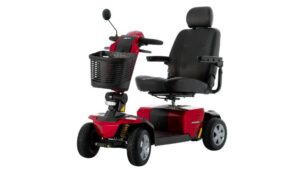 A red and black Eagle 4-Wheel Scooter by Golden Technologies, featuring a front basket, padded seat with armrests and headrest, rearview mirror, and four wheels, designed for personal transportation.