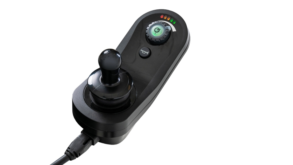 Black electronic joystick controller with a round knob, a control button, a rotary dial, LED indicator lights, and an attached cable—specially designed for the Jazzy EVO 614 Power Wheelchair—displayed on a white background.
