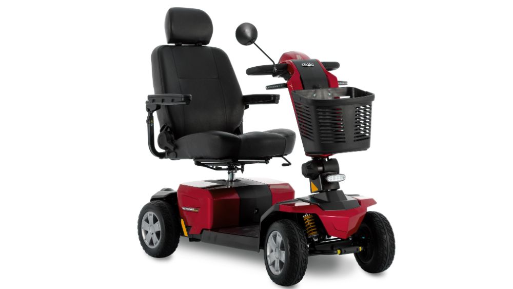 Victory LX Sport 4-Wheel Scooter in red with four wheels, featuring a black cushioned seat, armrests, headrest, front basket, and rearview mirror, displayed against a plain white background.