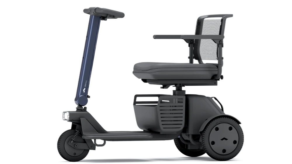 Side view of the WHILL Model R 3-Wheel, featuring a mesh-backed seat, armrests, and a single front headlight, set against a plain white background.