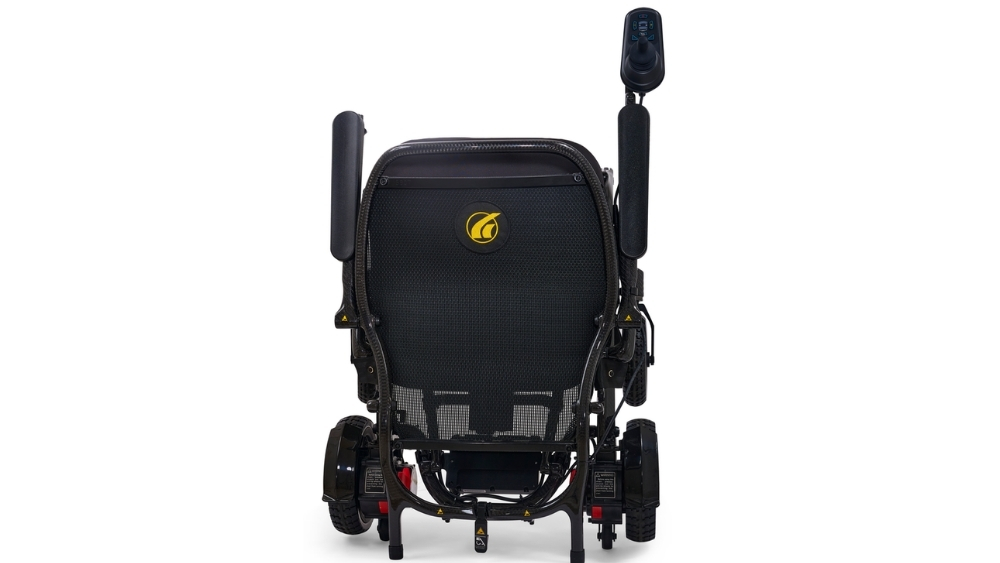 Rear view of a black Cricket Folding Power Wheelchair featuring a mesh backrest, joystick controller on the right armrest, and a yellow Cricket logo centered on the back.