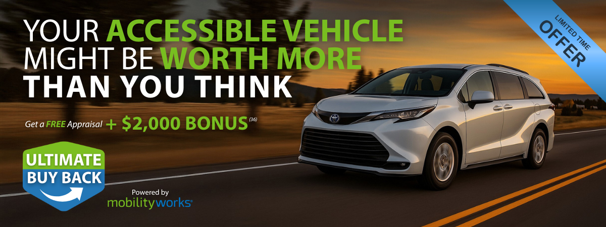 A silver accessible minivan drives on a road at sunset. Text promotes an appraisal and $2,000 bonus offer from MobilityWorks for accessible vehicles.