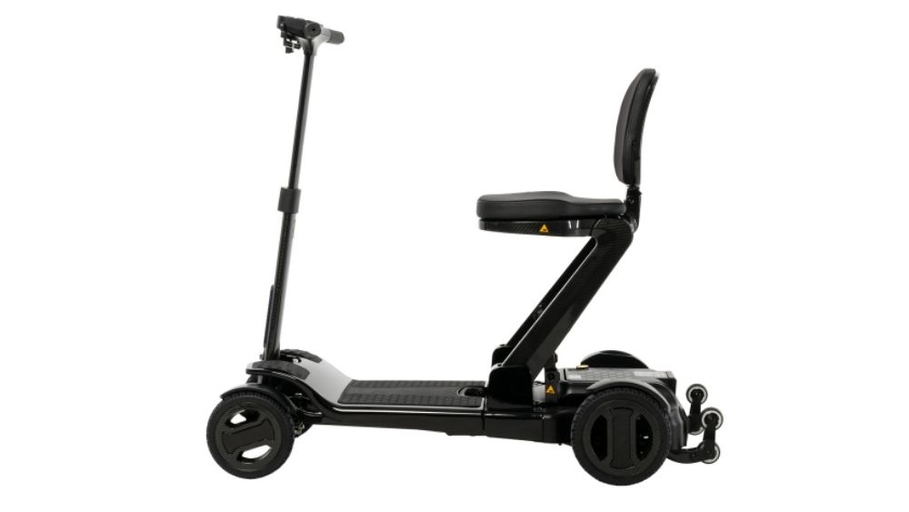 Go Go™ Carbon 4-Wheel Scooter in black, featuring a foldable design, seat with backrest, and four wheels, shown from the side on a white background.