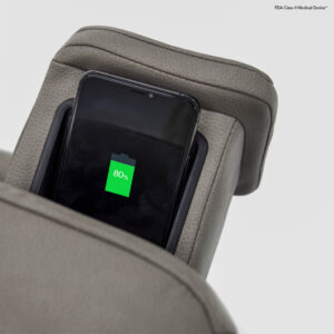 A smartphone displaying an 80% battery charge rests in the built-in slot of the gray VivaLift! Ultra Lift Chair.
