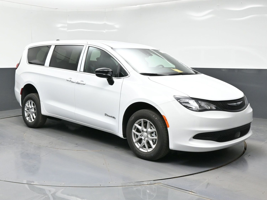 White Chrysler Voyager with BraunAbility Rear Entry Manual Fold Out conversion