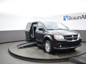 Black Dodge Grand Caravan with BraunAbility Side Entry Automatic Fold Out conversion