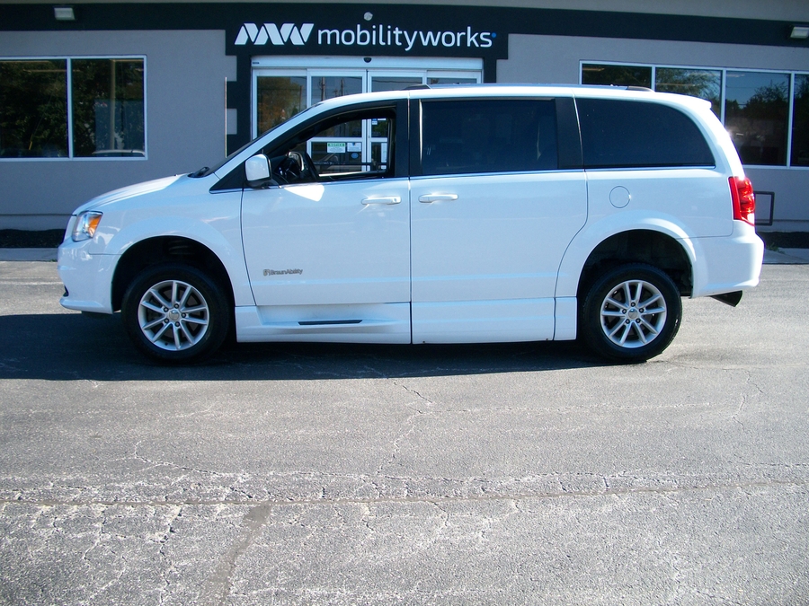 White Dodge Grand Caravan with BraunAbility Side Entry Automatic Fold Out conversion