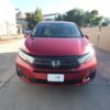 Red Honda Odyssey with BraunAbility Side Entry Automatic In Floor conversion