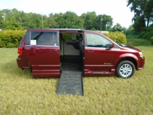 Red Dodge Grand Caravan with BraunAbility Side Entry Automatic Fold Out conversion