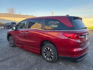 Red Honda Odyssey with BraunAbility Side Entry Automatic In Floor conversion