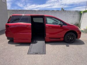 Red Honda Odyssey with BraunAbility Side Entry Automatic In Floor conversion