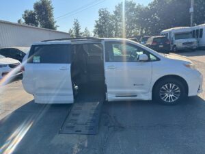 White Toyota Sienna with BraunAbility Side Entry Automatic Fold Out conversion