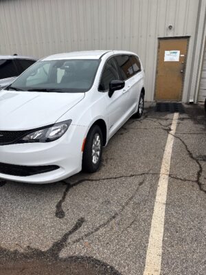 White Chrysler Voyager with Driverge Side Entry Automatic Fold Out conversion