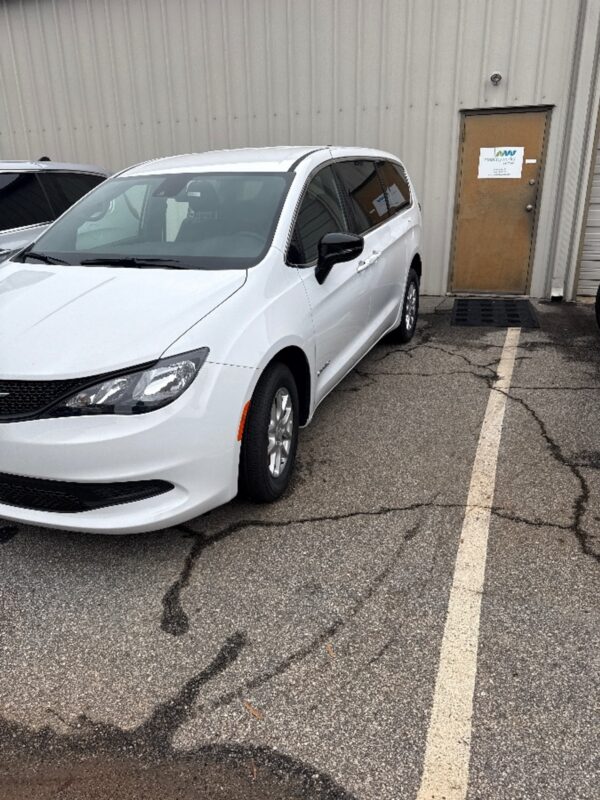 White Chrysler Voyager with Driverge Side Entry Automatic Fold Out conversion
