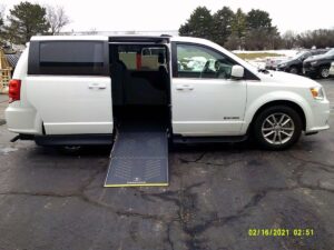 White Dodge Grand Caravan with Driverge Side Entry Automatic Fold Out conversion