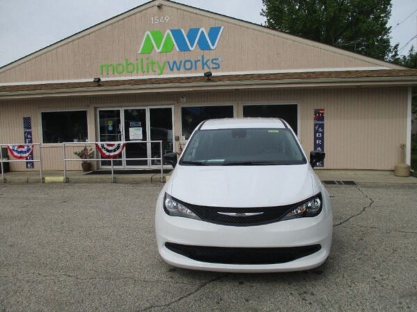 White Chrysler Voyager with Driverge Side Entry Automatic Fold Out conversion