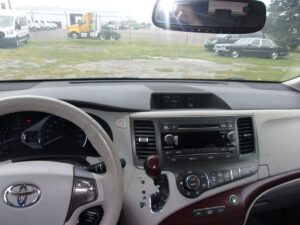 White Toyota Sienna with BraunAbility Side Entry Automatic Fold Out conversion