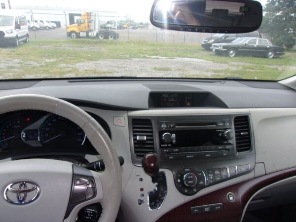 White Toyota Sienna with BraunAbility Side Entry Automatic Fold Out conversion