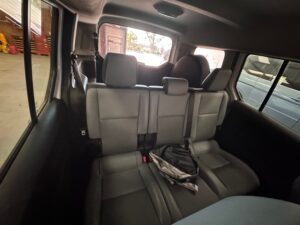 White Ford Transit Connect with Driverge Rear Entry Manual Fold Out conversion