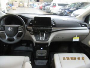 Silver Honda Odyssey with BraunAbility Side Entry Automatic In Floor conversion